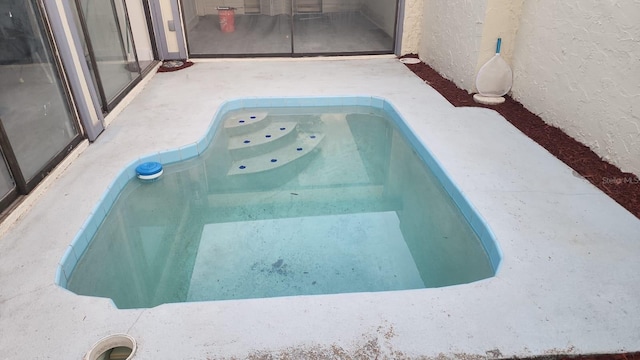outdoor pool featuring a patio