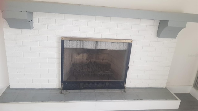 details with a brick fireplace