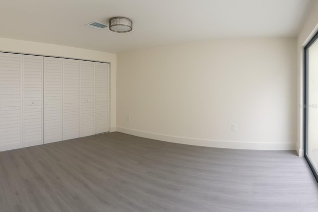 7314 Patio Row, Hudson, FL 34667 - unfurnished bedroom with wood finished floors and a closet