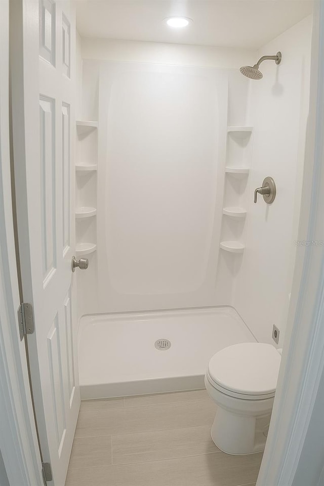 7314 Patio Row, Hudson, FL 34667 - bathroom with a shower and wood finished floors