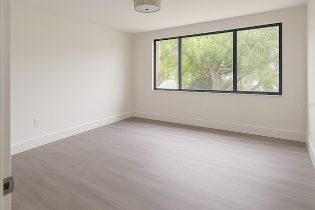 7314 Patio Row, Hudson, FL 34667 - unfurnished room featuring wood finished floors