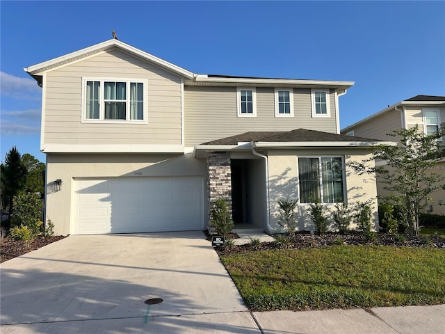 traditional home featuring stucco siding, driveway, and a garage