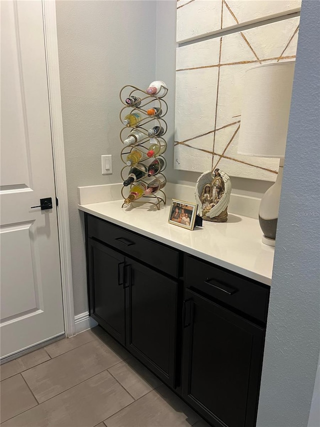 bathroom featuring tile patterned flooring and vanity