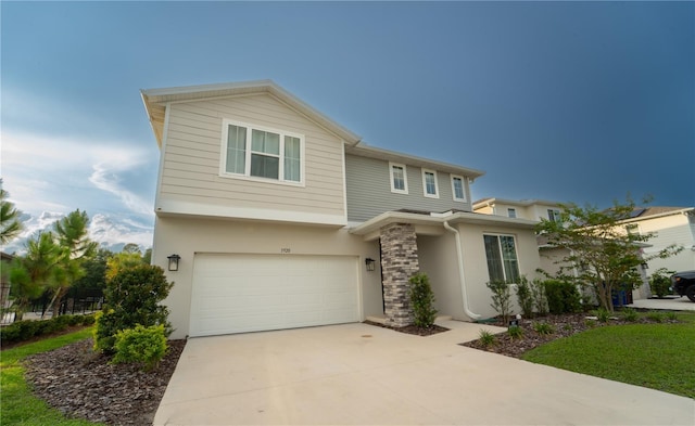 3920 Southern Vista Loop, Saint Cloud, FL 34772 - view of front of home featuring stucco siding, an attached garage, and driveway