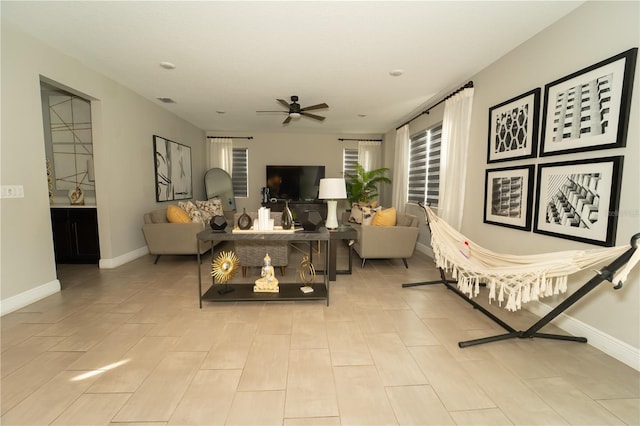 3920 Southern Vista Loop, Saint Cloud, FL 34772 - living room with a ceiling fan and baseboards