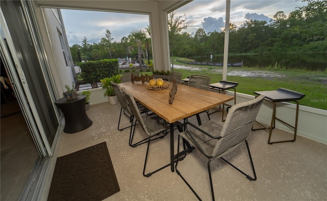 3920 Southern Vista Loop, Saint Cloud, FL 34772 - sunroom / solarium featuring baseboards and a water view