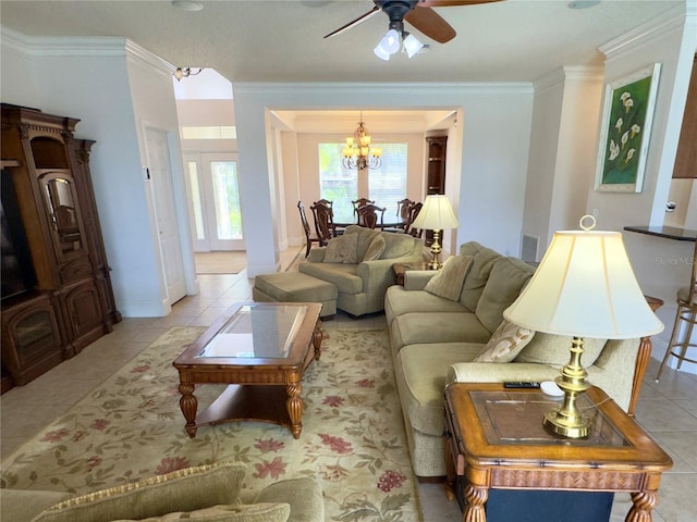 living area featuring crown molding, light tile patterned floors, and ceiling fan with notable chandelier