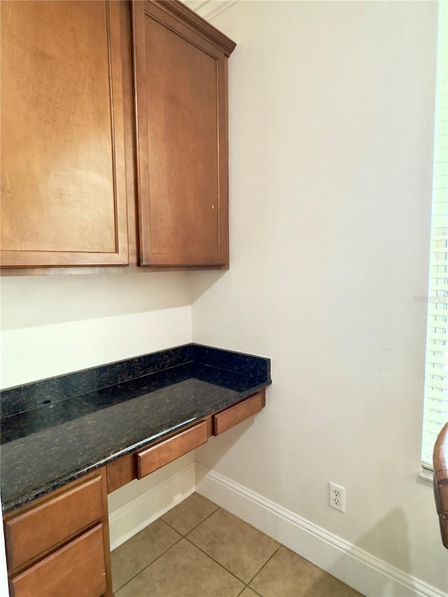 interior space featuring baseboards