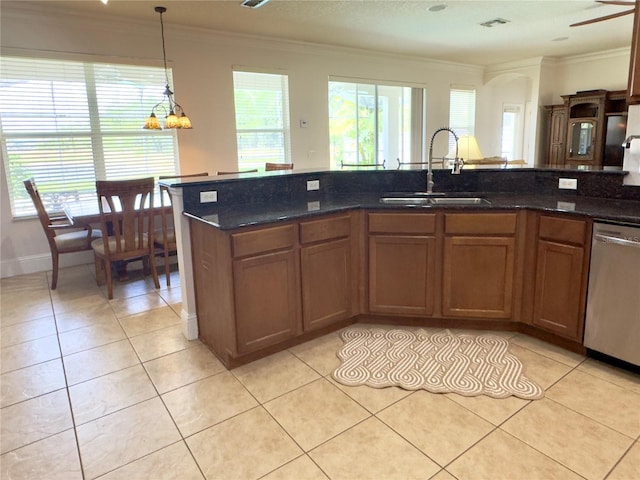 kitchen featuring a sink, crown molding, stainless steel dishwasher, and light tile patterned floors