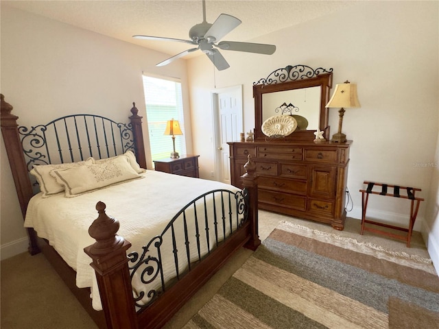 bedroom featuring carpet flooring, baseboards, and ceiling fan