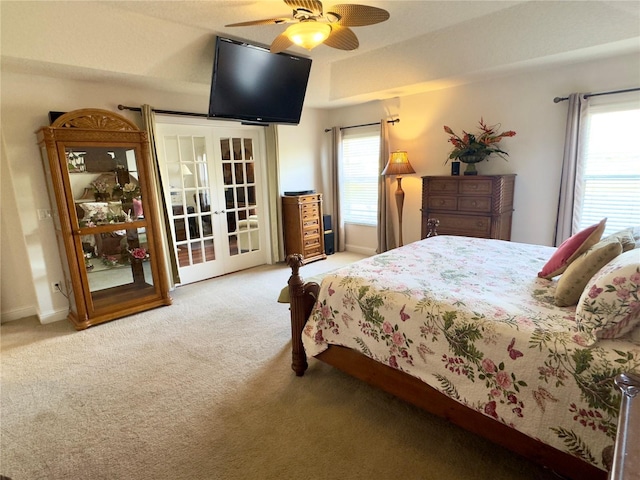 bedroom featuring a ceiling fan, french doors, and carpet