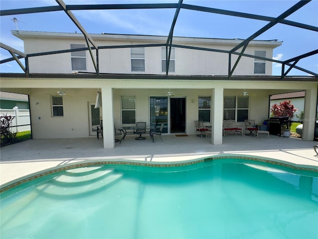 back of property featuring a patio area, stucco siding, and a ceiling fan