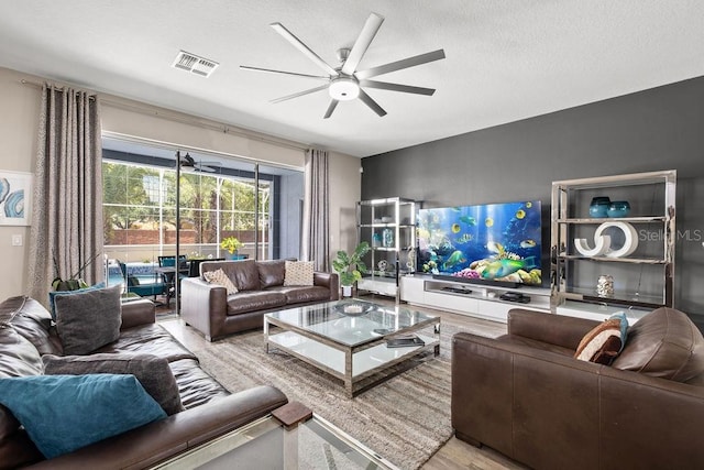 13044 Lakeshore Grove Dr, Winter Garden, FL 34787 - living room featuring a ceiling fan and wood finished floors