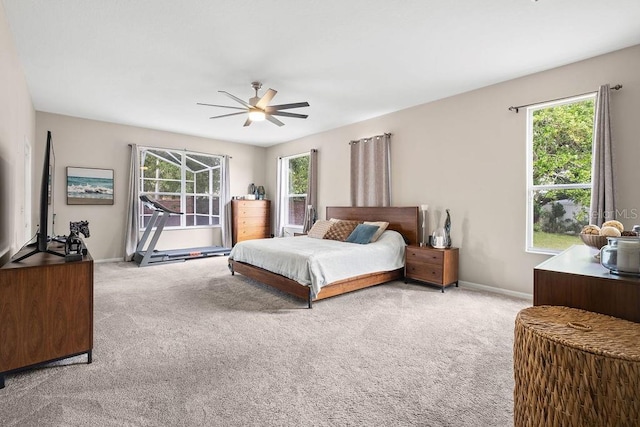 13044 Lakeshore Grove Dr, Winter Garden, FL 34787 - bedroom featuring carpet floors, multiple windows, baseboards, and ceiling fan