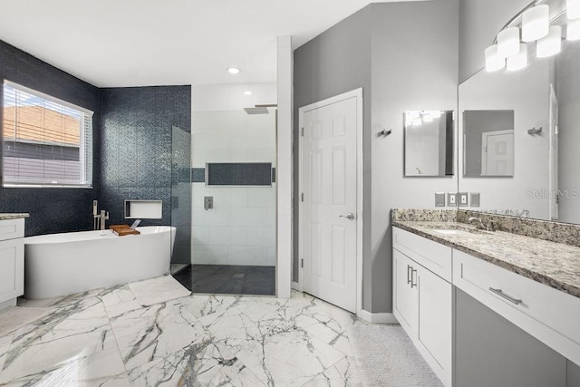 13044 Lakeshore Grove Dr, Winter Garden, FL 34787 - full bathroom with vanity, a walk in shower, a freestanding bath, recessed lighting, and marble finish floors