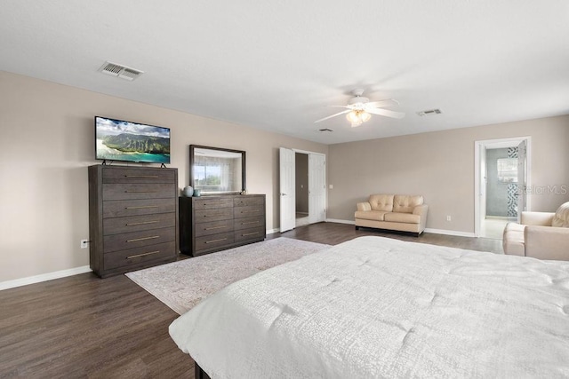 13044 Lakeshore Grove Dr, Winter Garden, FL 34787 - bedroom featuring dark wood-type flooring, baseboards, ceiling fan, and ensuite bath