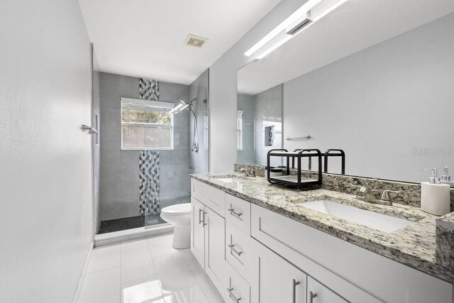 13044 Lakeshore Grove Dr, Winter Garden, FL 34787 - full bath featuring double vanity, a stall shower, and toilet