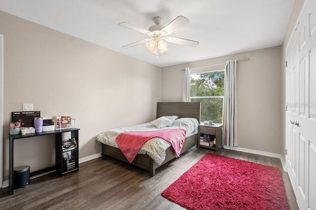 13044 Lakeshore Grove Dr, Winter Garden, FL 34787 - bedroom with dark wood-style flooring, baseboards, and a ceiling fan