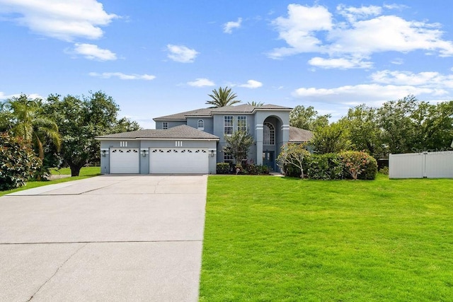 13044 Lakeshore Grove Dr, Winter Garden, FL 34787 - view of front of house featuring a garage, driveway, and stucco siding
