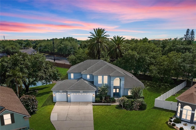 13044 Lakeshore Grove Dr, Winter Garden, FL 34787 - view of front facade with driveway and a garage