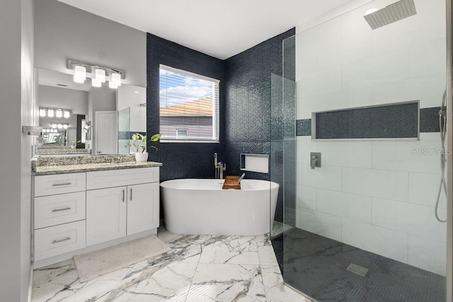 13044 Lakeshore Grove Dr, Winter Garden, FL 34787 - full bath featuring walk in shower, a freestanding tub, vanity, and marble finish floors