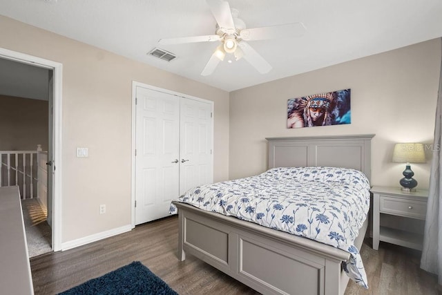 13044 Lakeshore Grove Dr, Winter Garden, FL 34787 - bedroom with wood finished floors, a closet, baseboards, and a ceiling fan