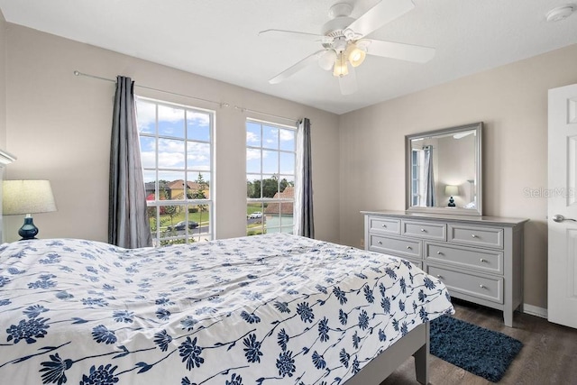 13044 Lakeshore Grove Dr, Winter Garden, FL 34787 - bedroom featuring dark wood-style flooring, ceiling fan, and baseboards