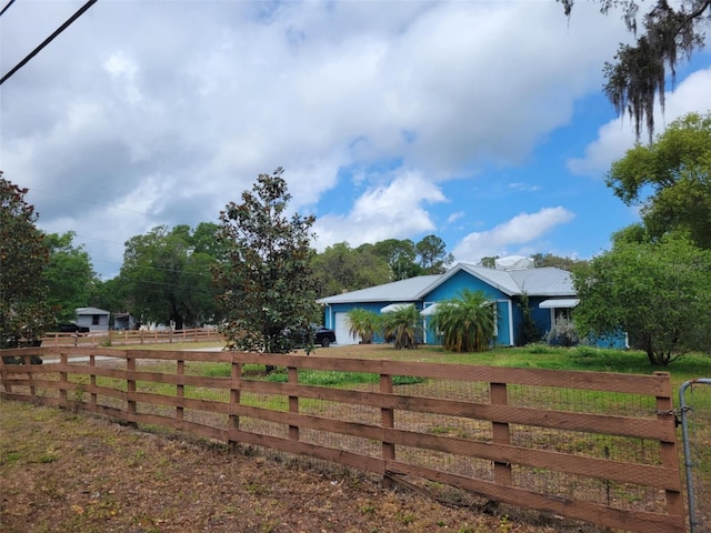 view of yard with fence and driveway