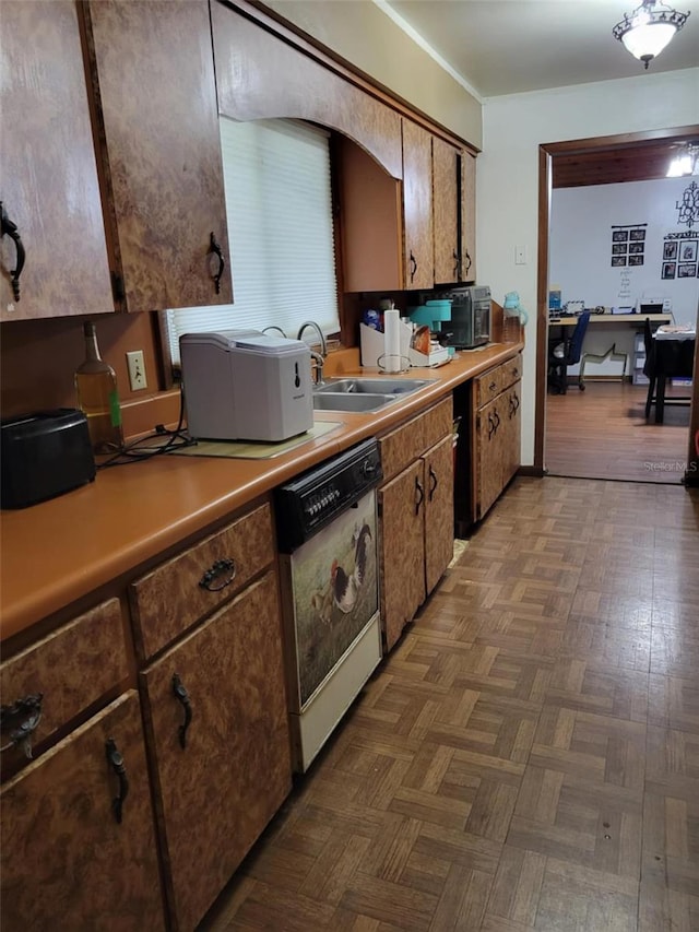 kitchen featuring a sink, light countertops, and dishwasher