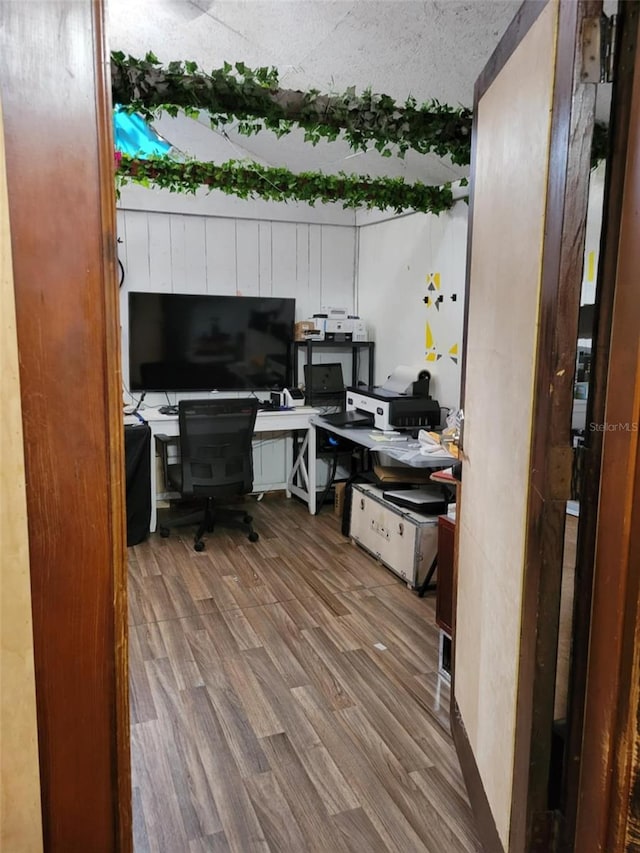 home office with wood finished floors