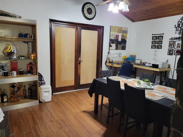 dining area with lofted ceiling, wood finished floors, and ceiling fan