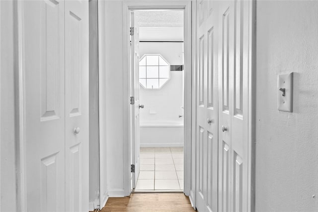 hallway featuring wood finished floors
