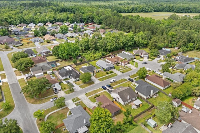 aerial view featuring a residential view and a forest view