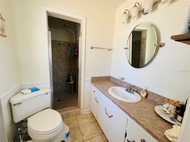 1419 Ave D NE, Winter Haven, FL 33881 - bathroom with a stall shower, toilet, vanity, and tile patterned flooring