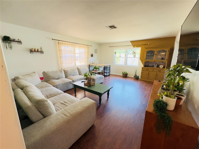 1419 Ave D NE, Winter Haven, FL 33881 - living area featuring dark wood-type flooring and baseboards