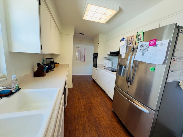 1419 Ave D NE, Winter Haven, FL 33881 - kitchen featuring black appliances, dark wood finished floors, a sink, and white cabinets