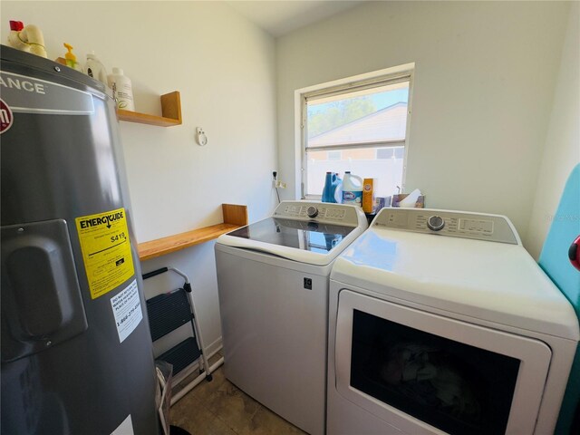1419 Ave D NE, Winter Haven, FL 33881 - clothes washing area with washer and clothes dryer and water heater