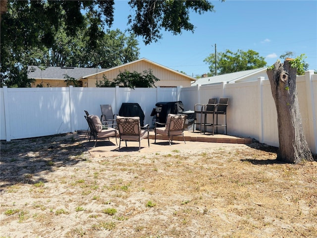 1419 Ave D NE, Winter Haven, FL 33881 - fenced backyard featuring a patio area