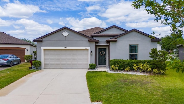 ranch-style house featuring a front yard, stucco siding, a garage, and driveway