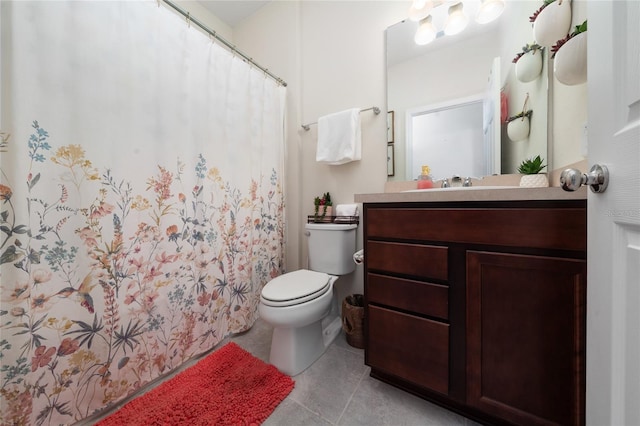 bathroom with toilet, tile patterned flooring, and vanity