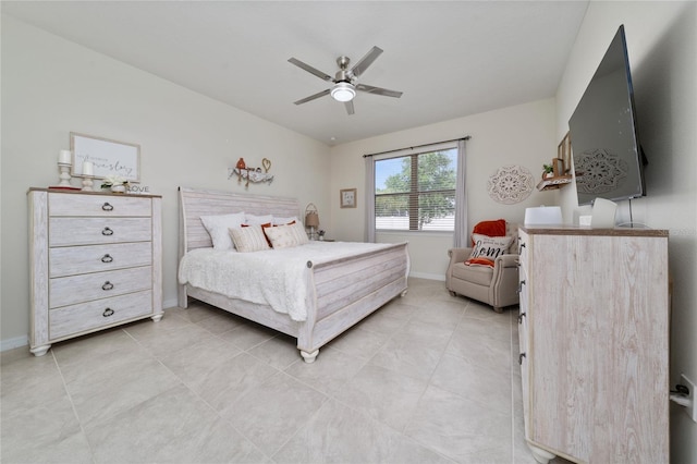 bedroom featuring light tile patterned floors, baseboards, and a ceiling fan