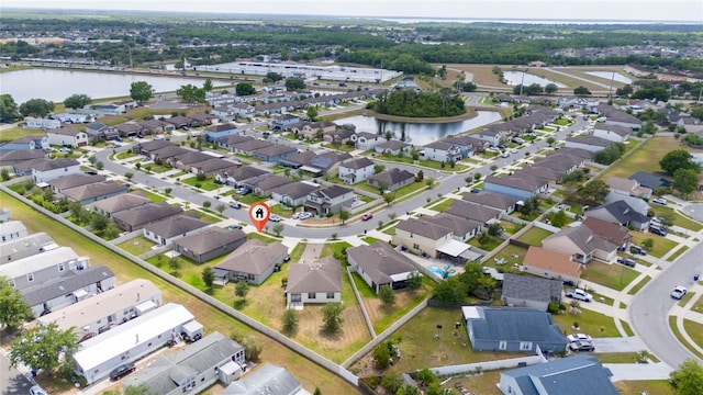 bird's eye view with a water view and a residential view