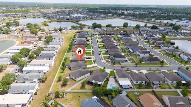 aerial view with a water view and a residential view