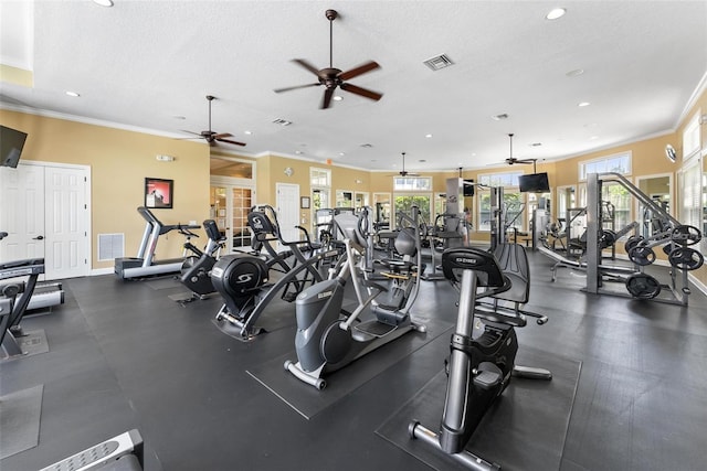 exercise room featuring ceiling fan, ornamental molding, a textured ceiling, recessed lighting, and baseboards