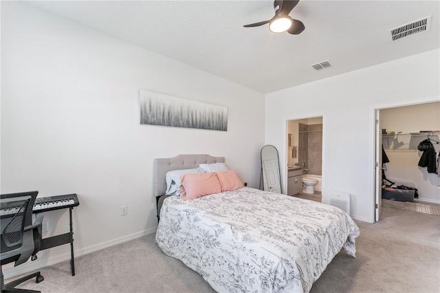 bedroom with carpet, visible vents, and a spacious closet