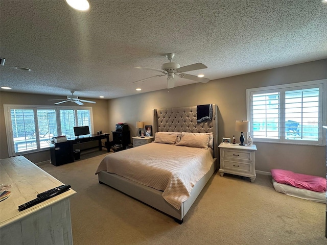 bedroom with a textured ceiling, light carpet, a ceiling fan, and recessed lighting