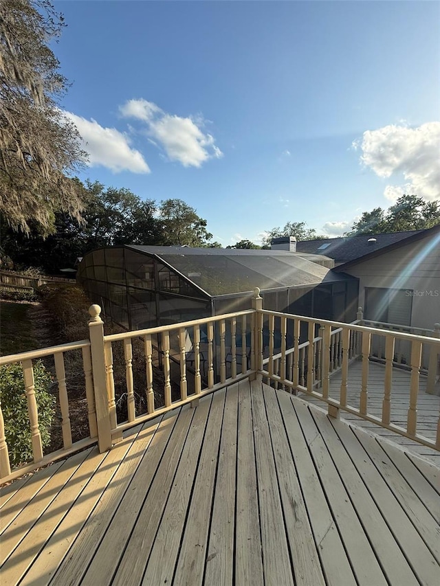 wooden terrace featuring a lanai