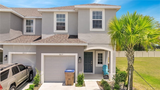 3617 Anibal St, Kissimmee, FL 34746 - traditional-style house with a front yard, roof with shingles, and stucco siding