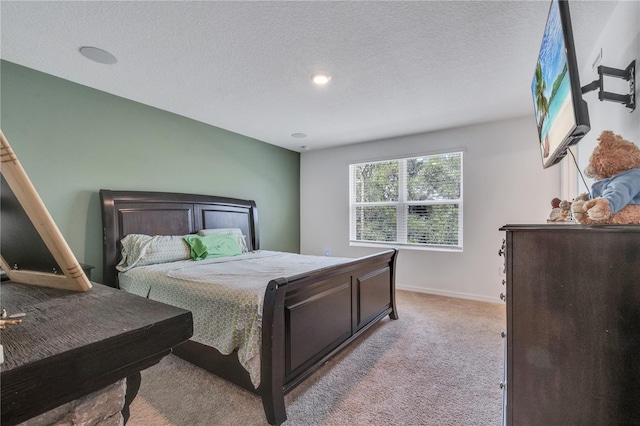 3617 Anibal St, Kissimmee, FL 34746 - bedroom with a textured ceiling, light colored carpet, and baseboards