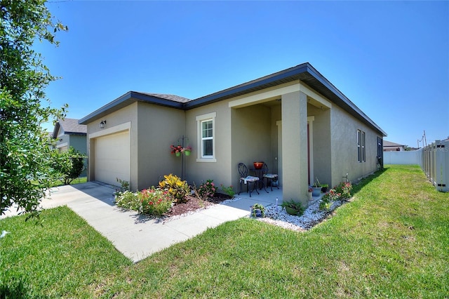 5816 Beefmaster Rd, Saint Cloud, FL 34771 - view of front of property featuring stucco siding, a garage, and concrete driveway